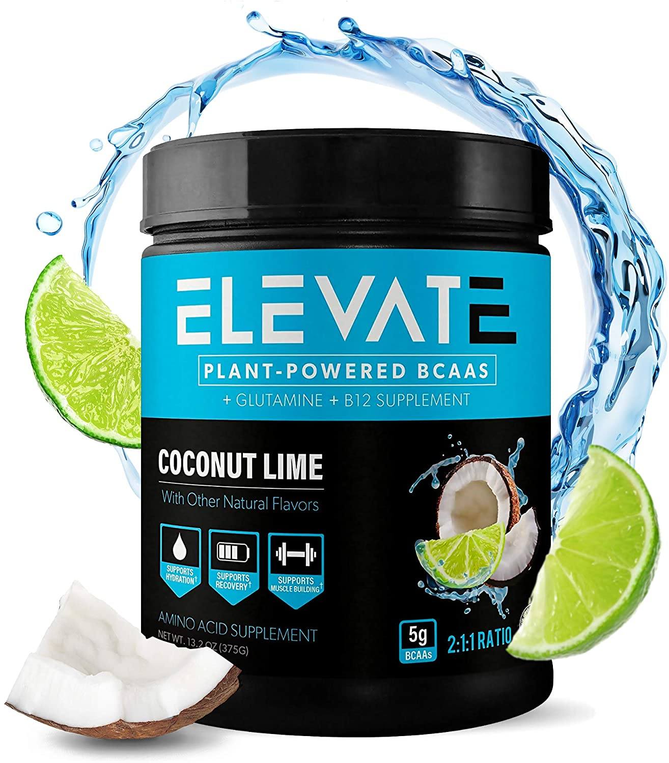 A tub of Elevate Plant-Based BCAA Powder. There is a lime and a coconut beside the tub.