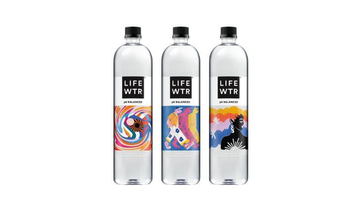 Three bottles of LIFEWTR Premium Bottled Water, a premium brand of water known for its pH balance and electrolytes.