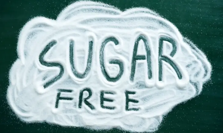 Pile of sugar with the words "SUGAR FREE" written on it.