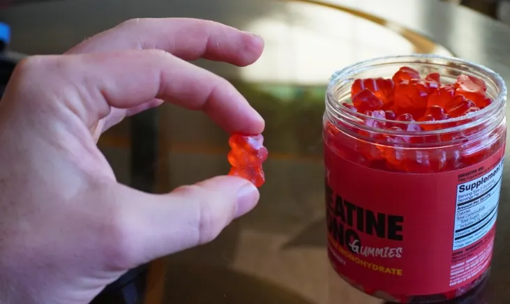 Fingers showcasing touchability of Swoly Creatine Gummies
