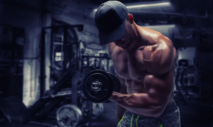 Man working out with dumbbells in the gym