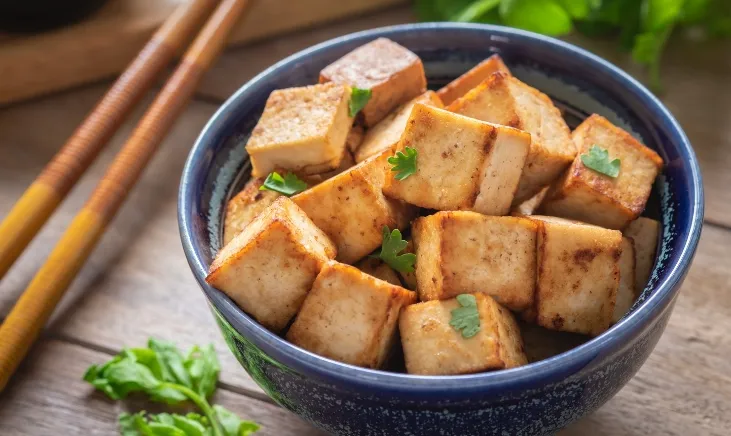 Close-up of golden-brown crispy tofu cubes
