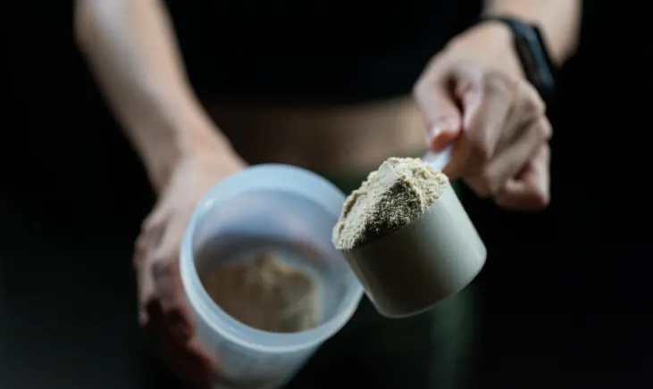 Close-up of whey protein powder in a scoop