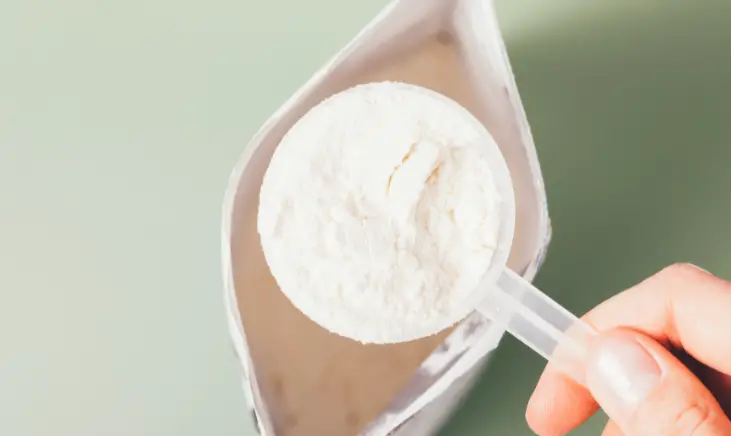 a picture of a scoop filled with dietary supplements powder
