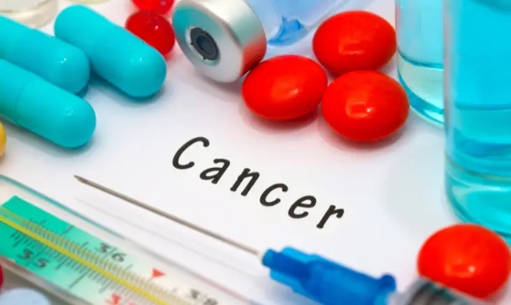 Cancer according to the text written on the piece of paper in the image.